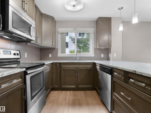 101 2207 44 Avenue, Edmonton, AB - Indoor Photo Showing Kitchen With Upgraded Kitchen