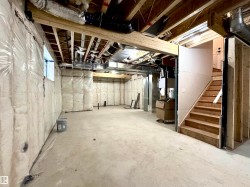 Below grade area featuring stairs - 