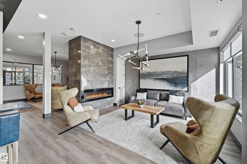 619 7463 May Common, Edmonton, AB - Indoor Photo Showing Living Room With Fireplace