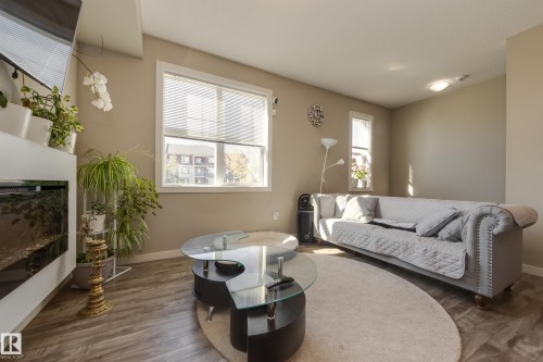 31 2803 James Mowatt Trail, Edmonton, AB - Indoor Photo Showing Living Room With Fireplace