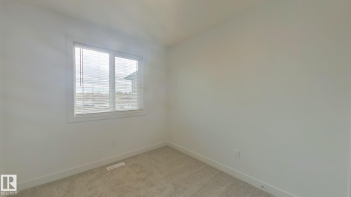 Main 1037 Aster Boulevard, Edmonton, AB - Indoor Photo Showing Other Room