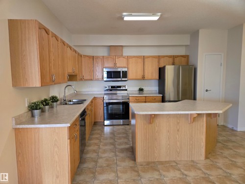 322 4304 139 Avenue, Edmonton, AB - Indoor Photo Showing Kitchen With Stainless Steel Kitchen With Double Sink