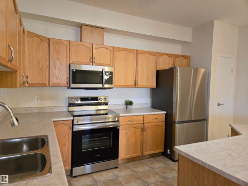 322 4304 139 Avenue, Edmonton, AB - Indoor Photo Showing Kitchen With Stainless Steel Kitchen With Double Sink
