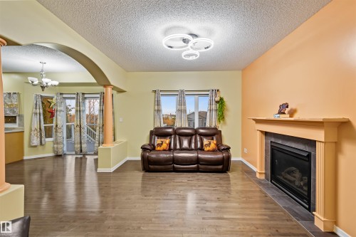 3449 28 Street, Edmonton, AB - Indoor Photo Showing Living Room With Fireplace
