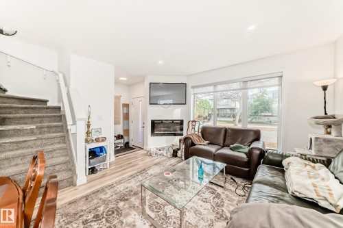 2 11326 95A Street, Edmonton, AB - Indoor Photo Showing Living Room With Fireplace