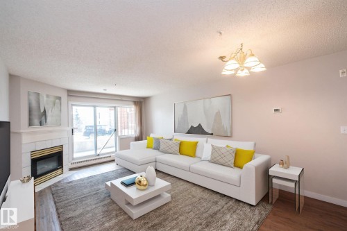112 11716 100 Avenue, Edmonton, AB - Indoor Photo Showing Living Room With Fireplace