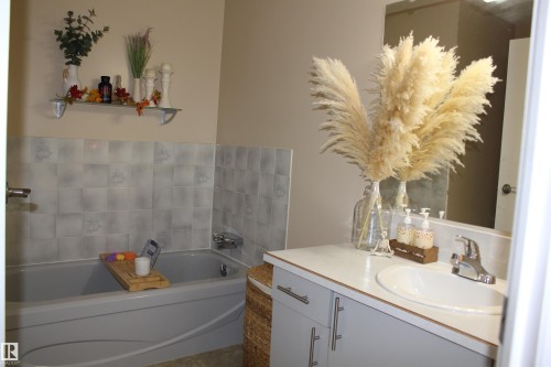 Full bath with vanity and a bath - 5221 54A Street, Elk Point, AB - Indoor Photo Showing Bathroom