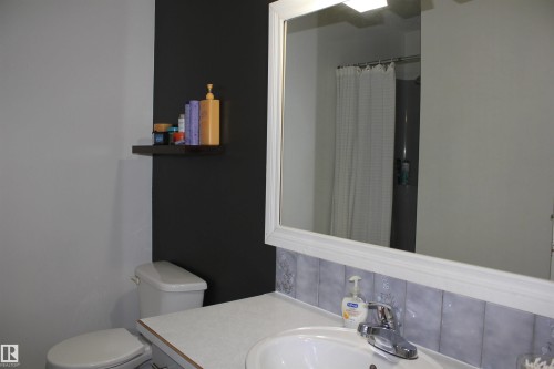 Full bathroom featuring vanity and curtained shower - 5221 54A Street, Elk Point, AB - Indoor Photo Showing Bathroom