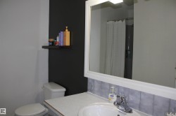 Full bathroom featuring vanity and curtained shower - 