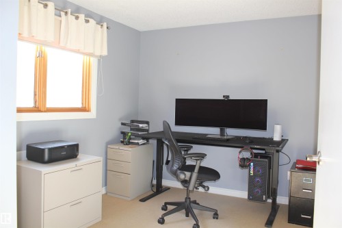 Home office with light carpet and baseboards - 5221 54A Street, Elk Point, AB - Indoor Photo Showing Office