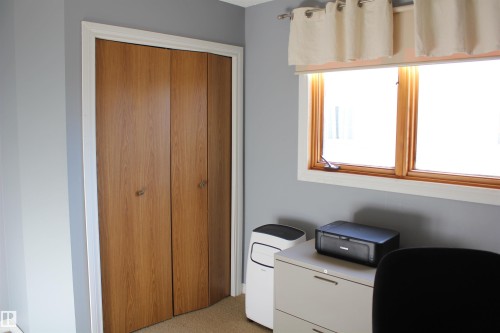 Office space featuring light colored carpet - 5221 54A Street, Elk Point, AB - Indoor