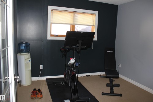 Exercise room with baseboards - 5221 54A Street, Elk Point, AB - Indoor Photo Showing Gym Room