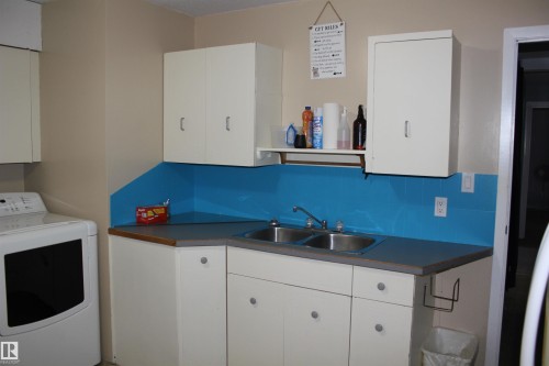 Laundry area featuring washer / clothes dryer - 5221 54A Street, Elk Point, AB - Indoor Photo Showing Laundry Room