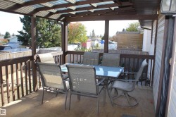 Wooden deck with outdoor dining area - 