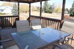 Wooden terrace with outdoor dining area - 