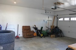 Garage featuring a garage door opener - 