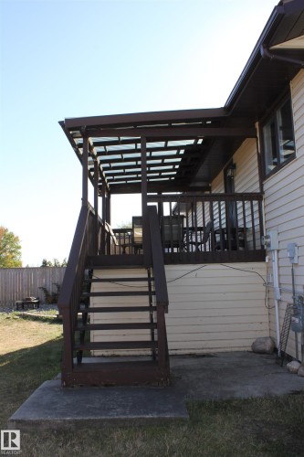 Wooden deck featuring stairway - 5221 54A Street, Elk Point, AB - Outdoor