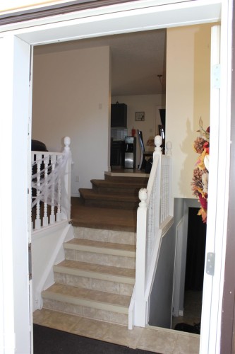 Stairs featuring tile patterned floors - 5221 54A Street, Elk Point, AB - Indoor Photo Showing Other Room