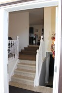 Stairs featuring tile patterned floors - 