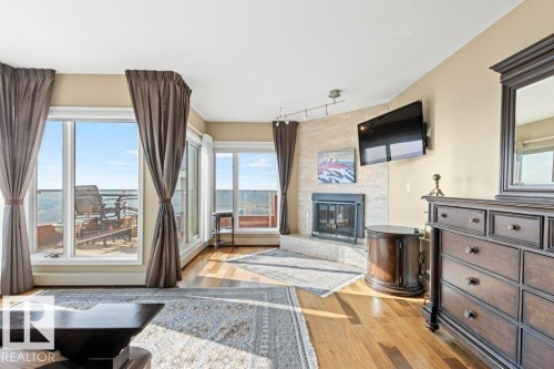 1701 10010 119 Street, Edmonton, AB - Indoor Photo Showing Living Room With Fireplace