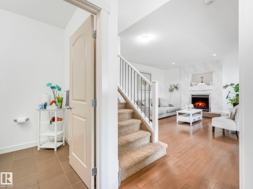 1004 Secord Promenade, Edmonton, AB - Indoor Photo Showing Other Room With Fireplace
