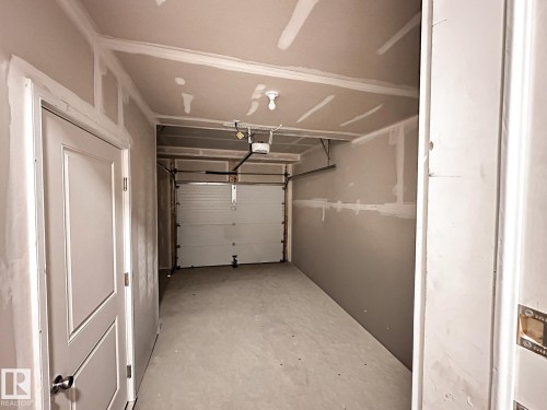 13 1025 Secord Promenade Promenade, Edmonton, AB - Indoor Photo Showing Garage