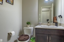 Half bathroom with toilet and vanity - 
