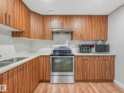1224 25 Avenue, Edmonton, AB - Indoor Photo Showing Kitchen With Double Sink