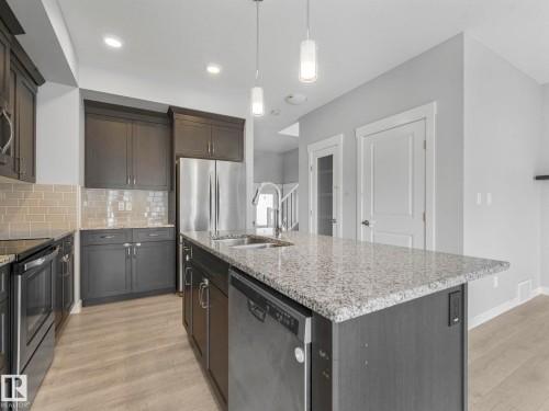 557 Sturtz Link, Leduc, AB - Indoor Photo Showing Kitchen With Stainless Steel Kitchen With Double Sink With Upgraded Kitchen