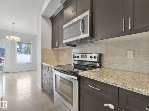 557 Sturtz Link, Leduc, AB - Indoor Photo Showing Kitchen With Stainless Steel Kitchen With Upgraded Kitchen