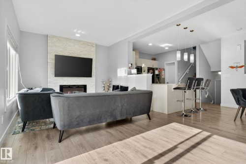 267 39 Ave, Edmonton, AB - Indoor Photo Showing Other Room With Fireplace