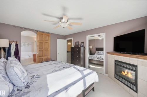 2311 Bailey Court, Edmonton, AB - Indoor Photo Showing Bedroom With Fireplace