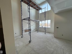 Unfurnished room featuring a high ceiling - 