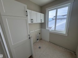 Washroom featuring cabinet space - 