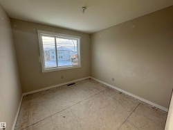 Empty room featuring baseboards - 