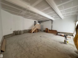 Unfinished basement featuring a heating unit - 