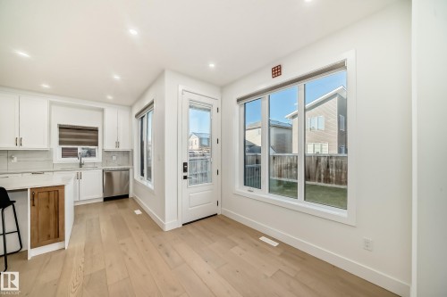 Doorway to outside featuring hardwood / wood-style flooring and recessed lighting - 42 Elwyck Gate, Spruce Grove, AB - Indoor Photo Showing Kitchen