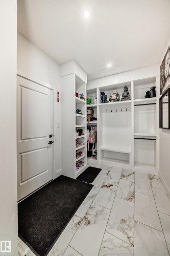 Mudroom featuring light marble finish flooring and recessed lighting - 42 Elwyck Gate, Spruce Grove, AB - Indoor Photo Showing Other Room