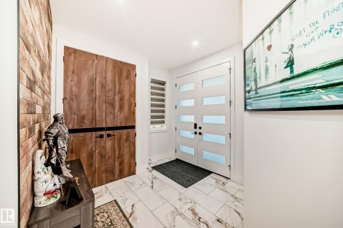 Foyer entrance with marble look tiles and recessed lighting - 42 Elwyck Gate, Spruce Grove, AB - Indoor Photo Showing Other Room