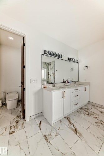 Bathroom featuring double vanity and light marble finish flooring - 42 Elwyck Gate, Spruce Grove, AB - Indoor Photo Showing Bathroom