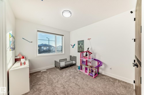 Game room with carpet floors and baseboards - 42 Elwyck Gate, Spruce Grove, AB - Indoor Photo Showing Other Room