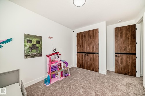 Recreation room featuring carpet and baseboards - 42 Elwyck Gate, Spruce Grove, AB - Indoor Photo Showing Other Room