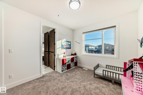 Bedroom featuring baseboards and light carpet - 42 Elwyck Gate, Spruce Grove, AB - Indoor