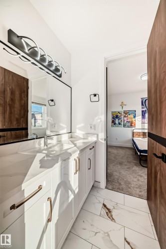 Full bathroom with double vanity, light marble finish flooring, and light colored carpet - 42 Elwyck Gate, Spruce Grove, AB - Indoor