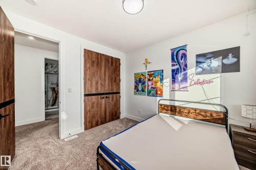 Bedroom with light colored carpet and a closet - 42 Elwyck Gate, Spruce Grove, AB - Indoor