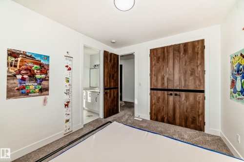 Unfurnished bedroom with carpet flooring, ensuite bathroom, and a closet - 42 Elwyck Gate, Spruce Grove, AB - Indoor Photo Showing Other Room