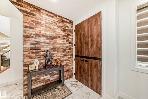 Entryway featuring marble finish floors and stairs - 42 Elwyck Gate, Spruce Grove, AB - Indoor Photo Showing Other Room