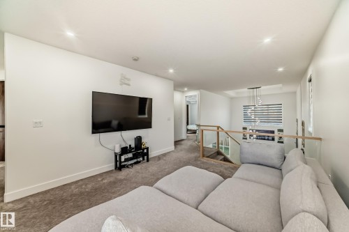 Carpeted living room featuring recessed lighting - 42 Elwyck Gate, Spruce Grove, AB - Indoor Photo Showing Living Room