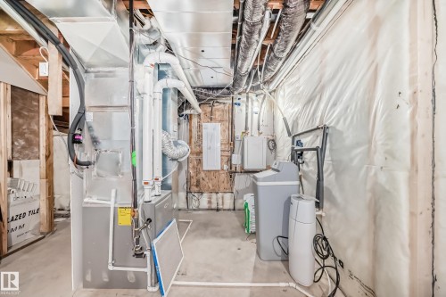Utility room featuring heating unit and electric panel - 42 Elwyck Gate, Spruce Grove, AB - Indoor Photo Showing Basement