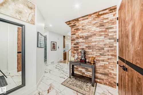 Hallway featuring light marble finish floors and recessed lighting - 42 Elwyck Gate, Spruce Grove, AB - Indoor Photo Showing Other Room
